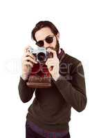 Hipster using his vintage camera