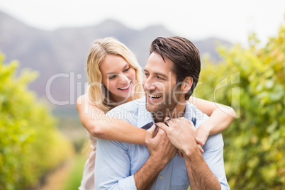 Young happy woman embracing young handsome man