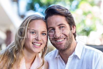 Smiling couple sitting closely together