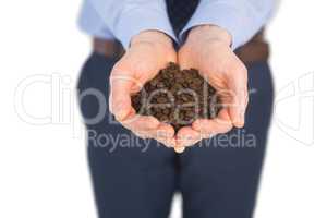 Businessman showing coffee beans