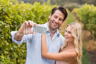 Young happy couple taking a selfie