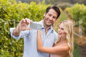 Young happy couple taking a selfie