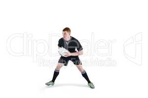 Rugby player running with a rugby ball
