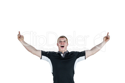 A rugby player gesturing victory