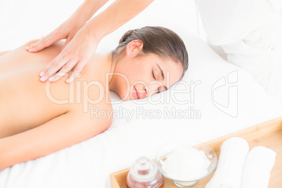 Pretty brunette enjoying a massage