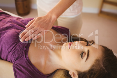 Young woman having a reiki treatment