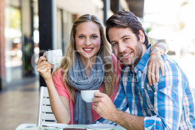 Cute couple having coffee together Cute couple having coffee together