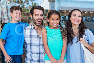 Happy family having fun in the mall