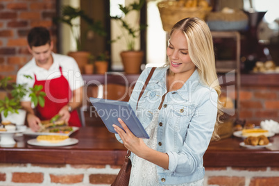 Pretty woman using her tablet