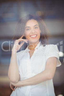 Smiling woman with arms folded