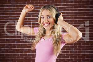 Portrait of a beautiful woman dancing with headphones