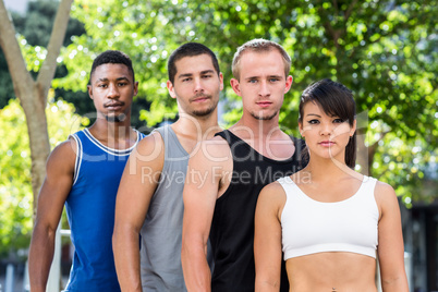 Portrait of extreme athletes standing in a row