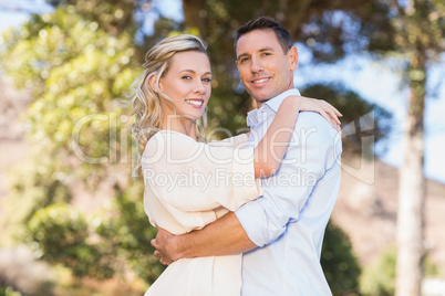 Portrait of smiling couple embracing