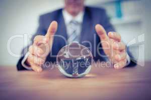 Businessman forecasting a crystal ball