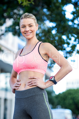 Portrait of a beautiful athlete with her hands on her hips