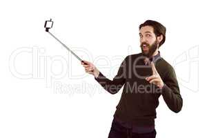 Hipster using his seflie stick