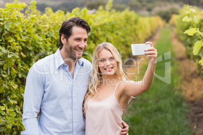 Young happy couple taking a selfie