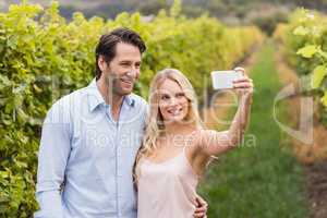 Young happy couple taking a selfie