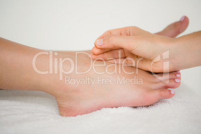 Woman holding a needle in an acupuncture therapy