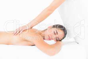 Beautiful young pretty woman on massage table