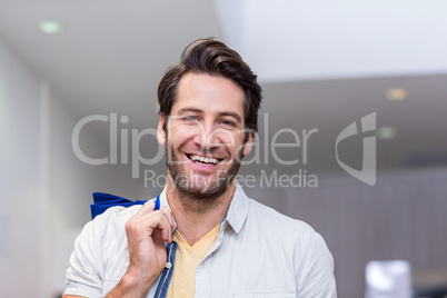 Smiling man with shopping bags