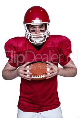 American football player holding a ball