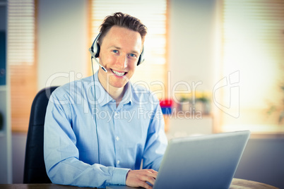 Casual businessman using headset on a call