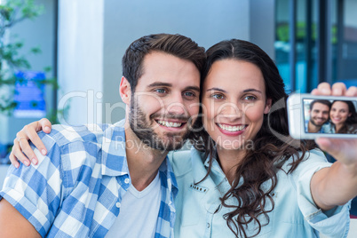 Young happy couple making a selfie