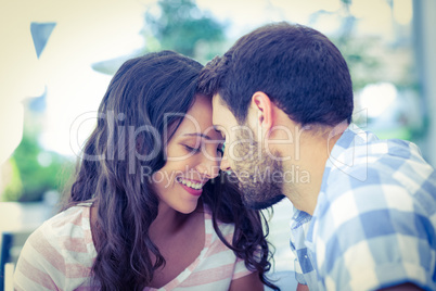 Cute couple putting foreheads against each others