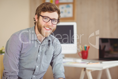 Bearded hipster smiling at camera