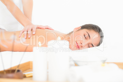 Pretty brunette enjoying a massage