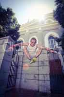 Extreme athlete jumping in front of building