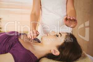 Young woman having a reiki treatment