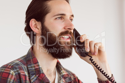 Hipster businessman working at his desk