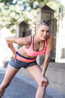 Pretty blonde woman preparing herself for a run