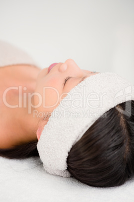 Relaxed woman lying on the massage table