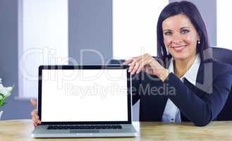 Confident businesswoman showing her laptop