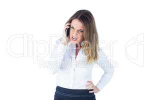 Angry businesswoman talking on the phone