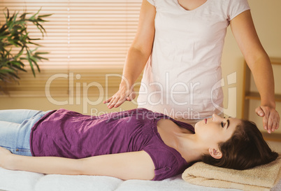 Young woman having a reiki treatment