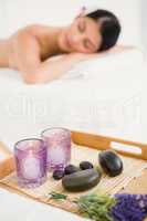Focus on the massage tray with stones