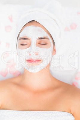 Attractive having white cream on her face