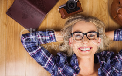 Portrait of gorgeous smiling blonde hipster lying