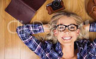 Portrait of gorgeous smiling blonde hipster lying