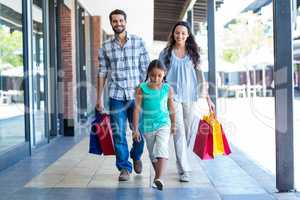 Happy family with shopping bags