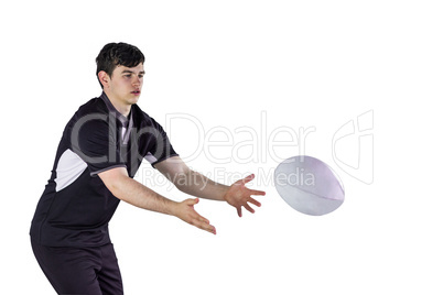 Rugby player throwing a rugby ball