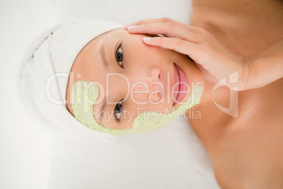 Portrait of a beautiful brunette getting a facial treatment