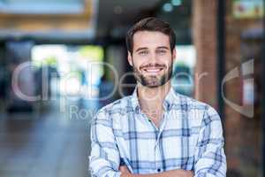 Portrait of man with arms crossed looking at camera