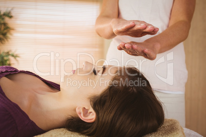 Young woman having a reiki treatment