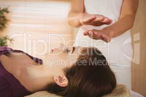 Young woman having a reiki treatment