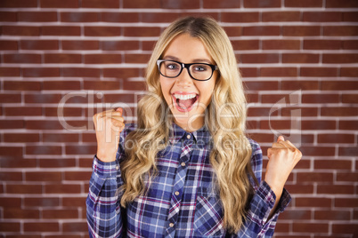 Gorgeous blonde hipster celebrating success